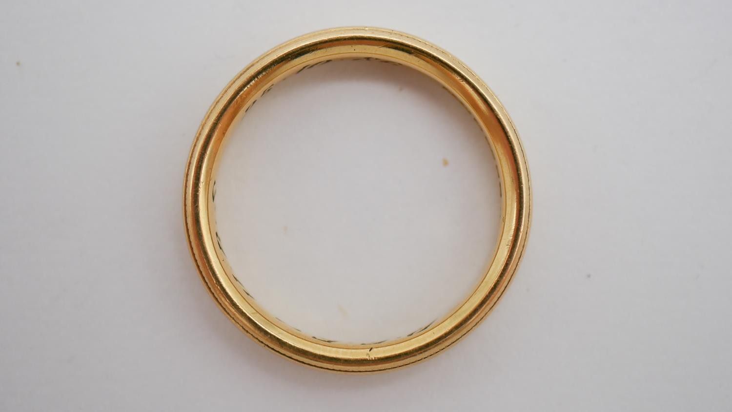 A size Q 18 carat yellow gold court shaped wedding band, engraved to the interior 'REF. HBS, 25.10. - Image 2 of 6