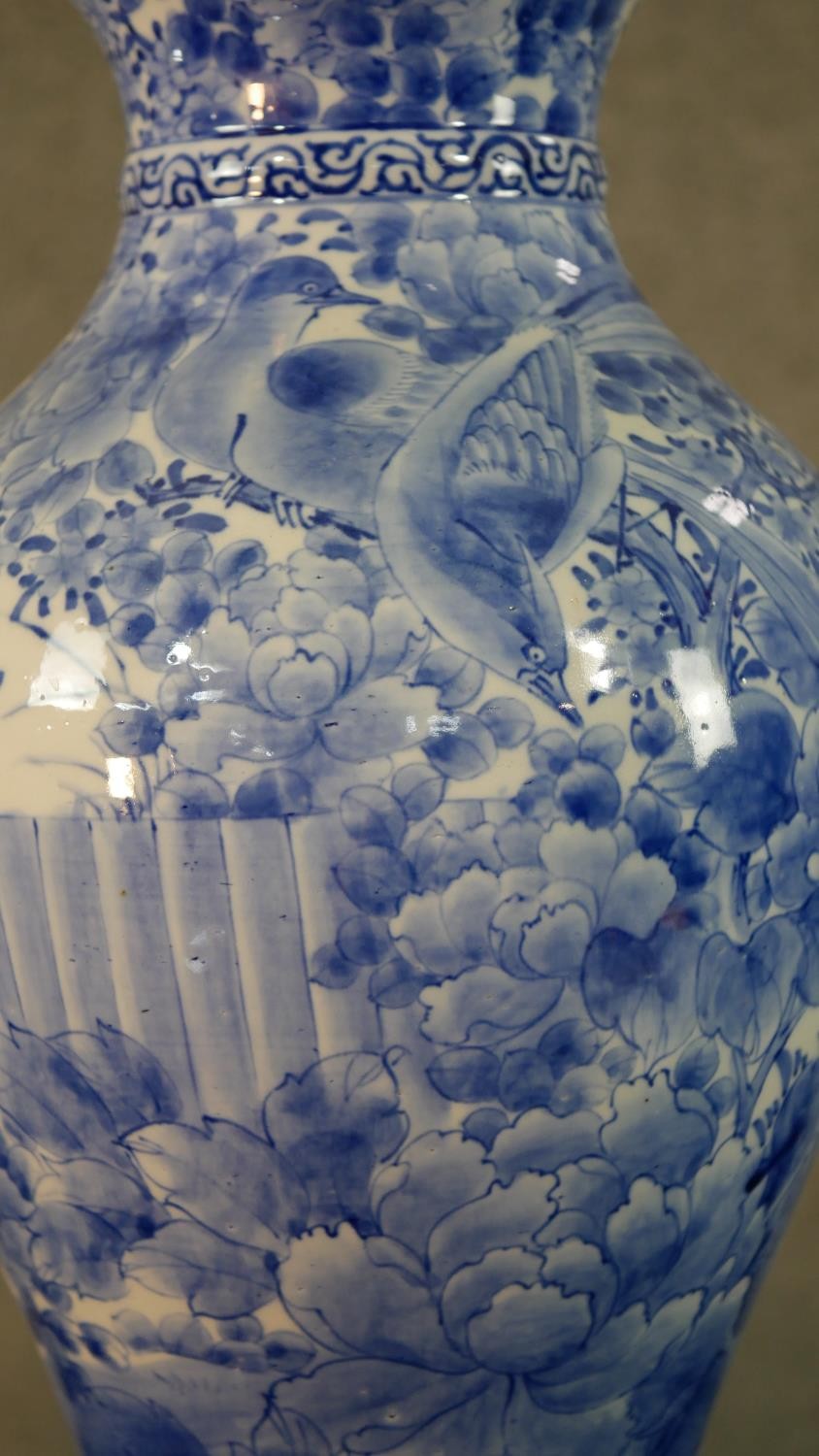 A large Japanese early 20th century blue and white hand painted porcelain vase with fluted edge. - Image 4 of 12