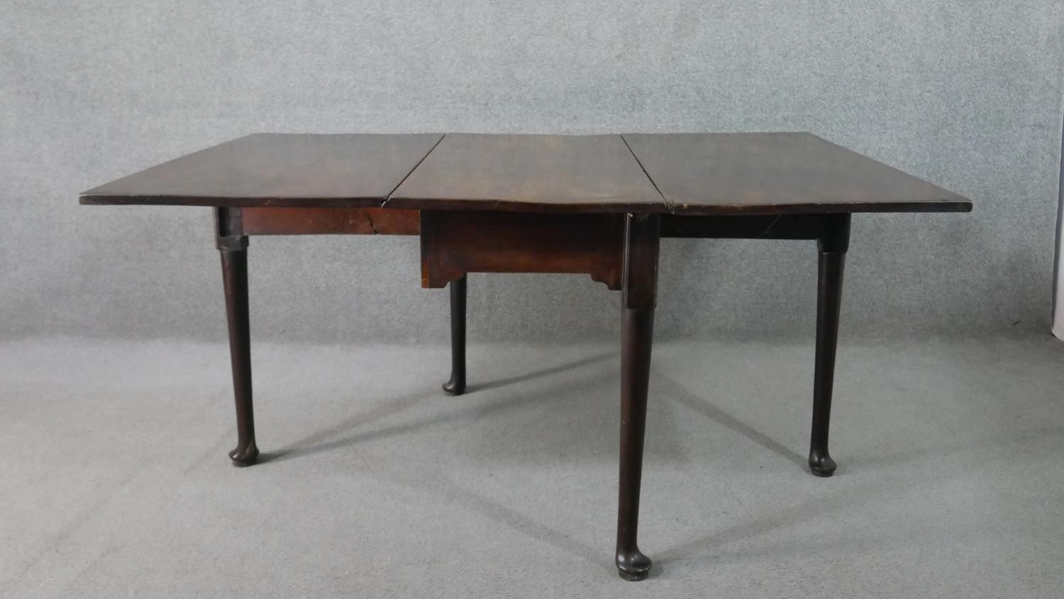 A mid 18th century mahogany drop leaf dining table, with a rectangular top, the legs with pad - Image 3 of 7