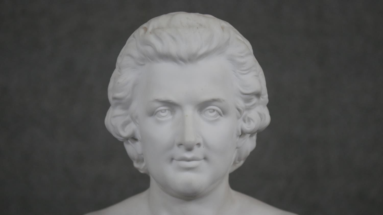 A Parian ware bust of Mozart, the bust inscribed below and on plinth base. H.30 W.18 D.10cm - Image 3 of 8