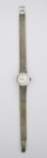 A lady's Omega 9 carat white gold manual wind vintage wrist watch, the silver dial with applied