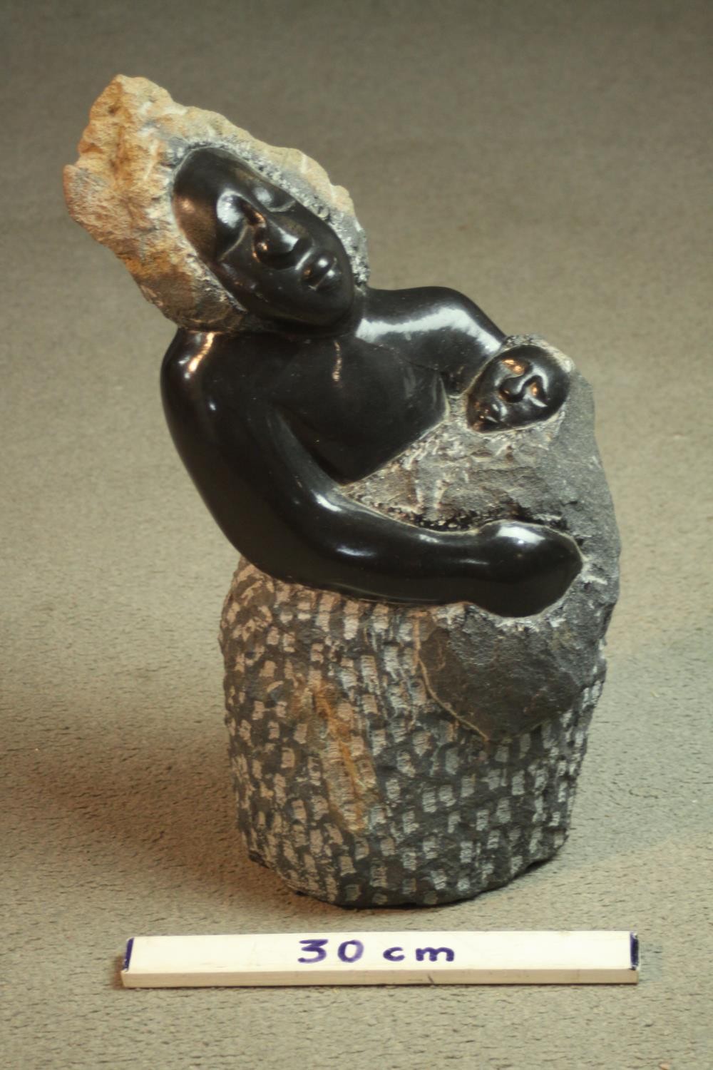 A Zimbabwean School carved soapstone sculpture of a mother and child. Unsigned. H.50cm. - Image 2 of 7