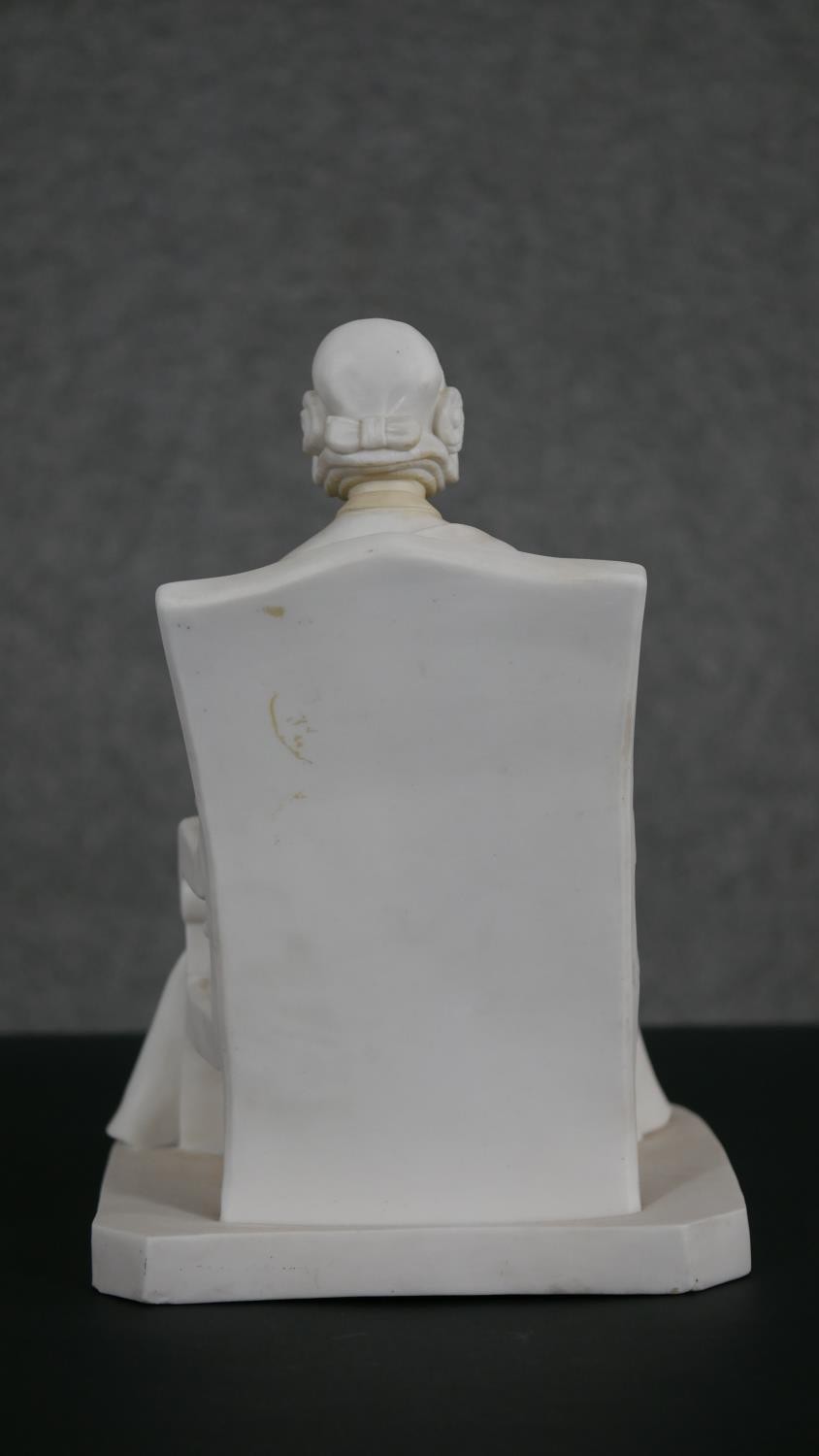 A Minton Parian ware model of an elderly lady seated in an armchair, a book open on her lap. - Image 3 of 8
