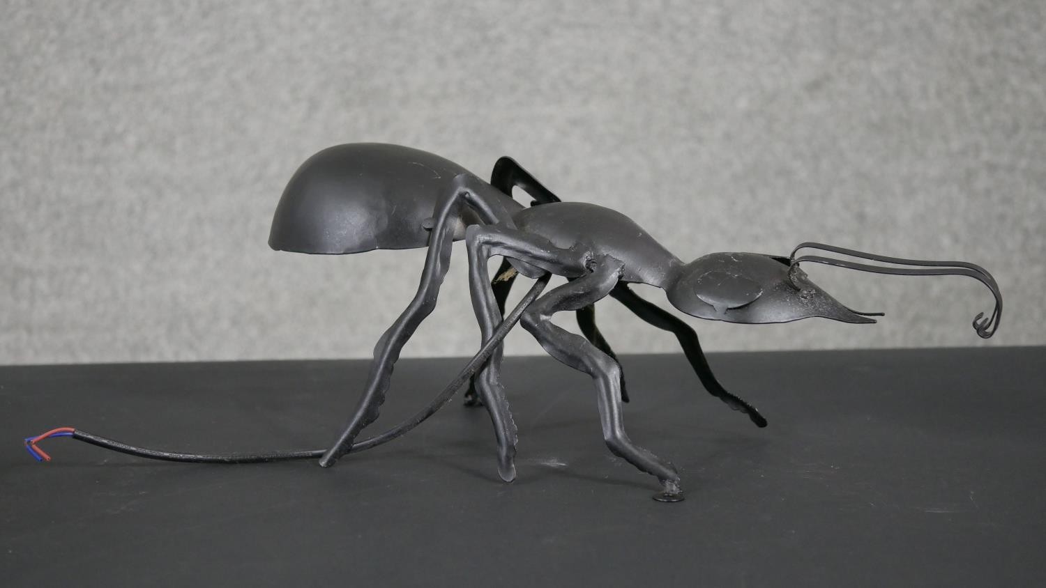 A metal ant wall light along with an acrylic head and star table lamp mounted on a wooden block. H. - Image 6 of 8