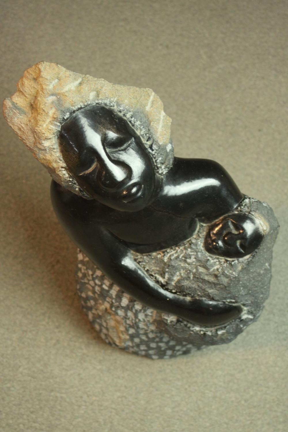 A Zimbabwean School carved soapstone sculpture of a mother and child. Unsigned. H.50cm. - Image 3 of 7