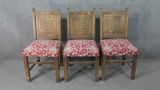 A set of three oak side chairs, carved to the back with the House of Commons portcullis logo,