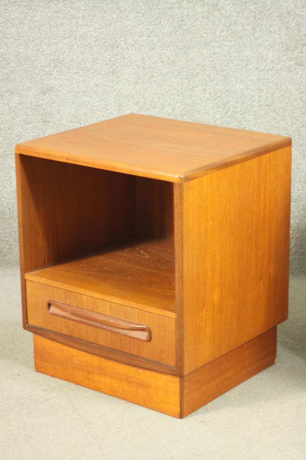 A pair of G-Plan teak bedside cabinets, with a recess over a single drawer, on a plinth base. H.53 - Image 7 of 13