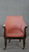 A William IV mahogany armchair, upholstered in patterned pink fabric, the carved and reeded