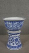 A Chinese blue and white porcelain jardinière on waisted plinth base, flowers and foliage with Greek