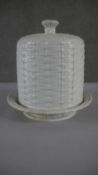 A 19th century woven design white ceramic lidded cheese cloche. H.30 W.30cm