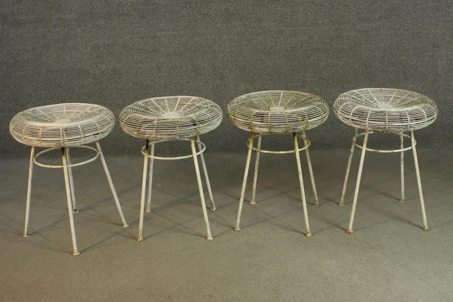 A white painted iron garden set, comprising a circular table and four stools. H.72 Dia.70cm (table) - Image 5 of 7