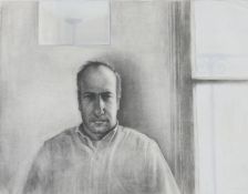 An unframed charcoal portrait of a man by a window, signed R. Levy. H.71 W.86cm (inc. mount)