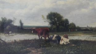 A gilt framed and glazed oil on canvas of cows by the river, signed A Van Damme and named to the