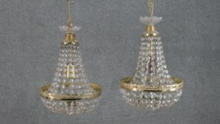 A pair of Empire style brass and crystal drop tent chandeliers. H.36 Diam.26cm