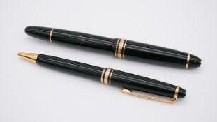 Two Mont Blanc Meisterstuck ball point pens, one with screw lid, GX1857615 and CX114443. Accompanied