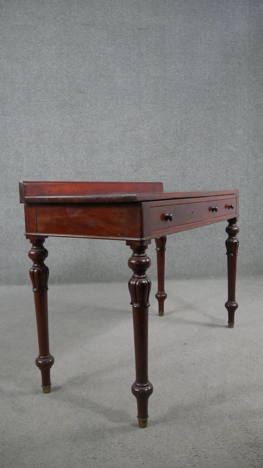 A Victorian mahogany side table, with a gallery back above two short frieze drawers, on carved and - Image 8 of 8