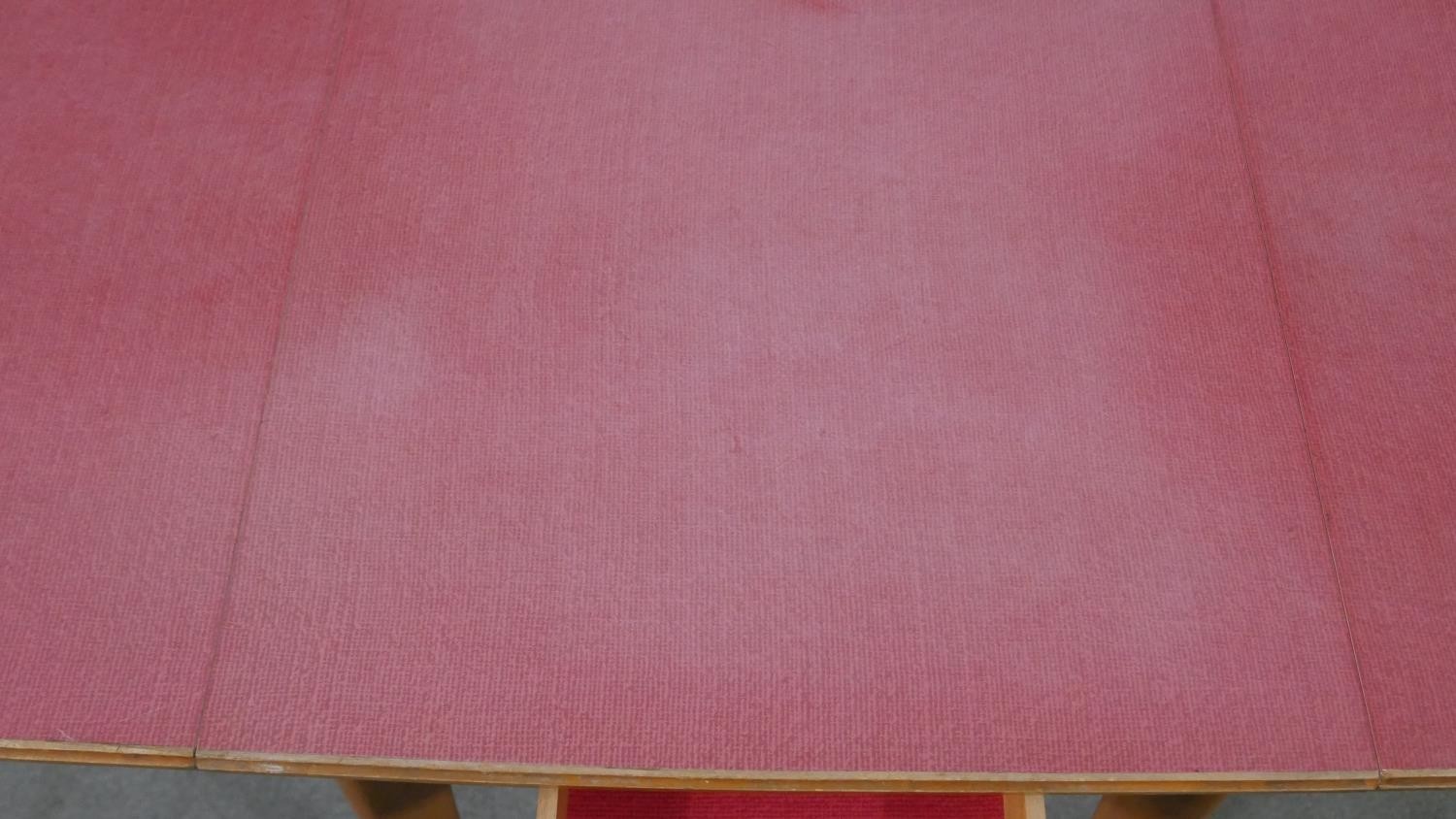 A 1950s drop leaf beech kitchen table, with a pink formica top and a single end drawer. H.78 W.47 - Image 3 of 5