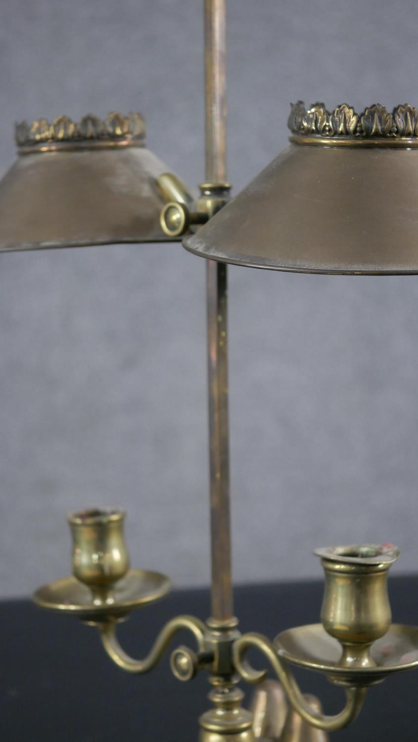 A 19th century brass double rise and fall student's candle lamp with scrolled arm supports. H.49 W. - Image 7 of 8
