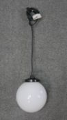 A pair of modern ceiling lights with white glass globe shades. H.18 W.19cm