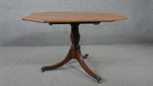 A George III mahogany tilt top breakfast table, the plum pudding top crossbanded in satinwood, of