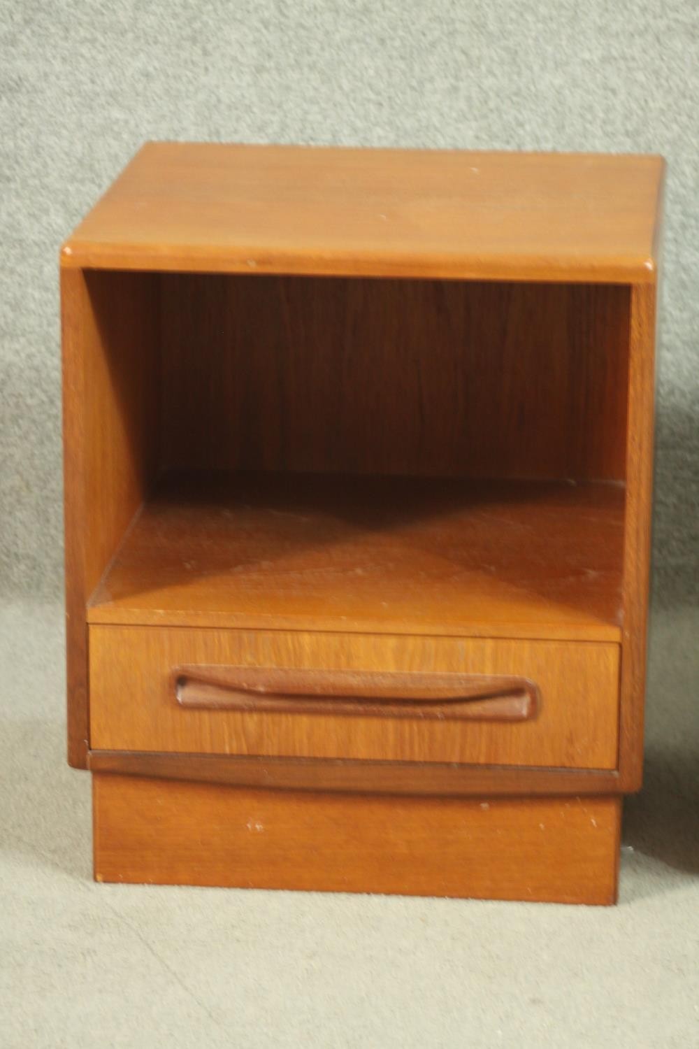 A pair of G-Plan teak bedside cabinets, with a recess over a single drawer, on a plinth base. H.53 - Image 4 of 13