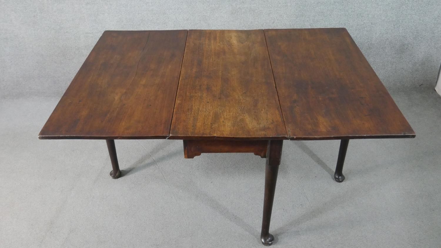 A mid 18th century mahogany drop leaf dining table, with a rectangular top, the legs with pad - Image 4 of 7