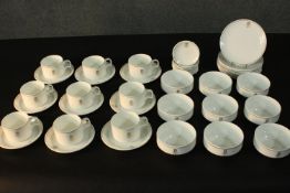 A complete nine person metallicized bone china dinner service by Wedgwood made for Laker Airlines,