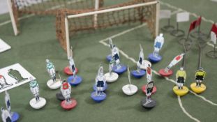 A vintage Subbuteo table soccer game by P. A. Adolph, with instructions, spare goal, extra players