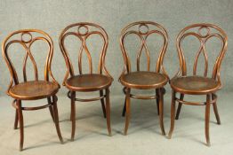 A set of four late 19th/early 20th century Thonet style bentwood chairs, with circular pokerwork