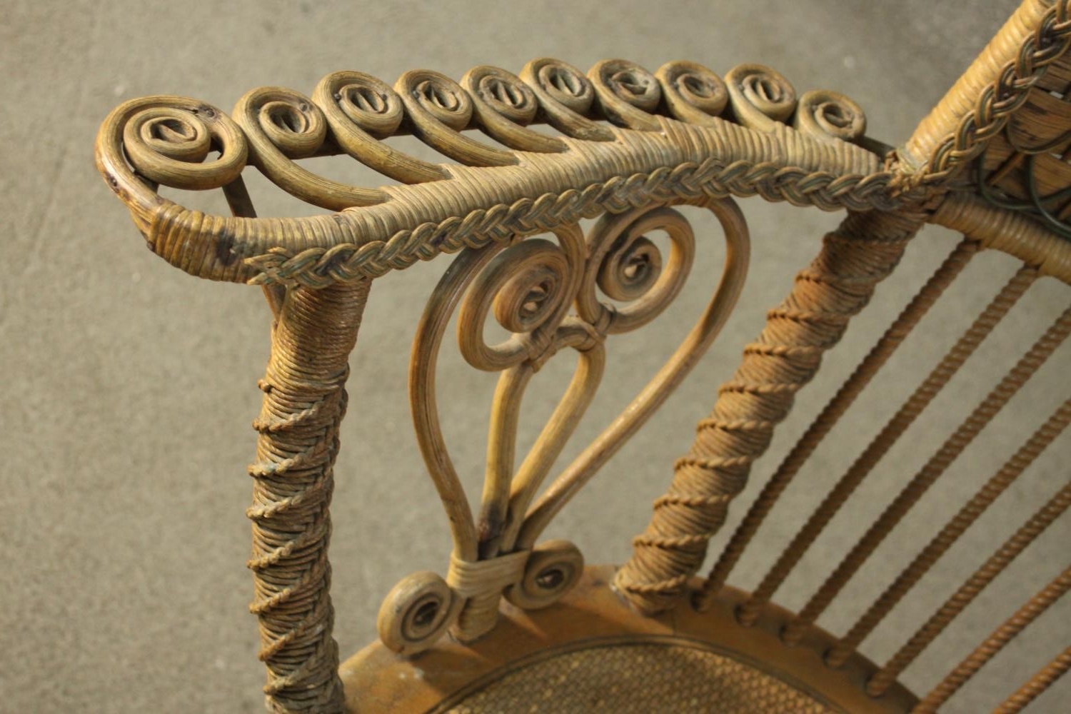 A late 19th/early 20th century wicker open armchair, with a rattan woven backrest, the arms with - Image 5 of 7