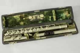 A vintage cased flute by Wilhelm Heckel, Biebrich, Germany. H.6 L.43 D.10cm (case)