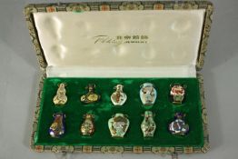 A Peking jewellery set consisting of a ten gold tone cloisonné pendants in the form of Chinese snuff