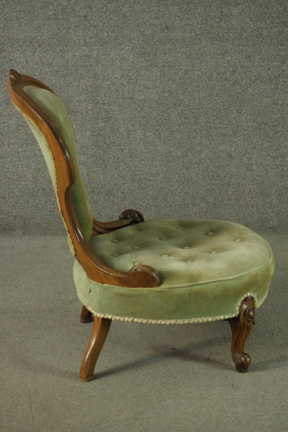 A late 19th century French walnut nursing chair, upholstered with green velour to the buttoned - Image 3 of 6