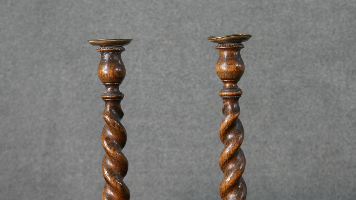 A pair of vintage oak barleytwist candlesticks along with a collection of five carved rustic - Image 4 of 8