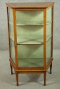 An Edwardian Sheraton Revival mahogany display cabinet, crossbanded with satinwood, with glazed door