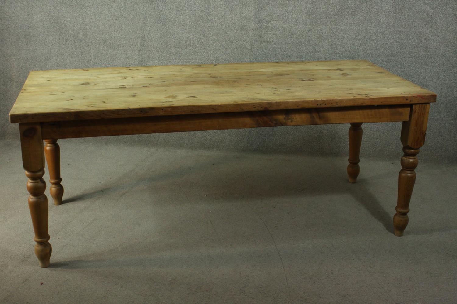 A pine refectory farmhouse dining table, with a rectangular top, on turned legs. - Image 3 of 7