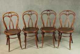 A set of four late 19th/early 20th century Thonet style bentwood chairs, with circular pokerwork