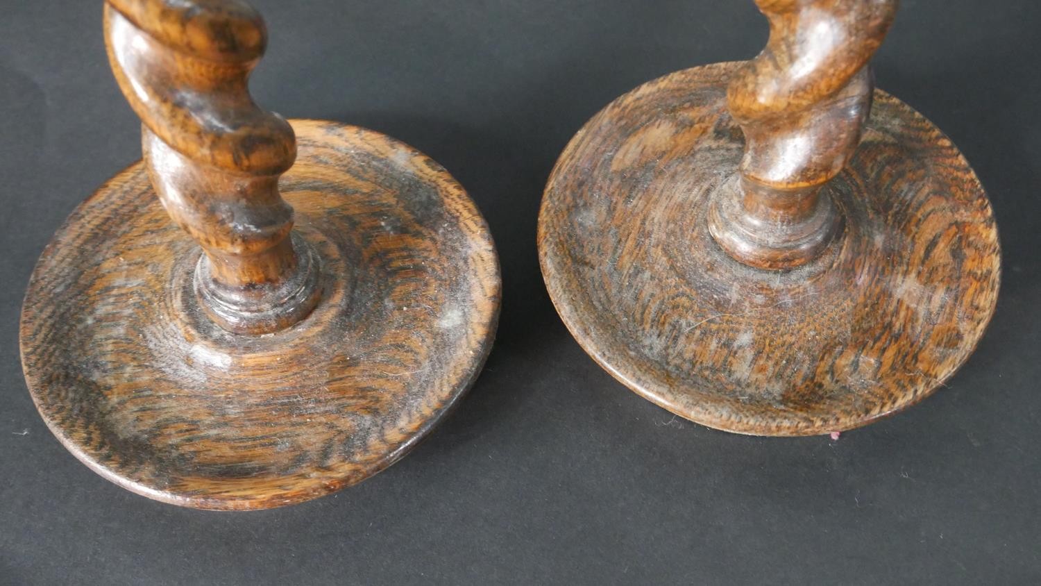 A pair of vintage oak barleytwist candlesticks along with a collection of five carved rustic - Image 6 of 8