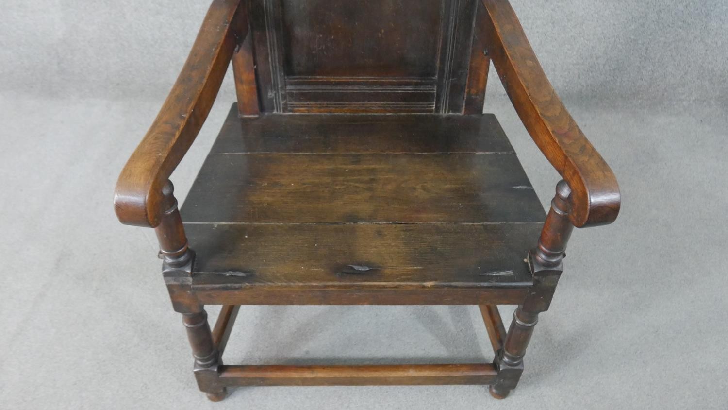 A late 19th century oak wainscot armchair, the panelled back with scrolling top rail, over open - Image 3 of 6