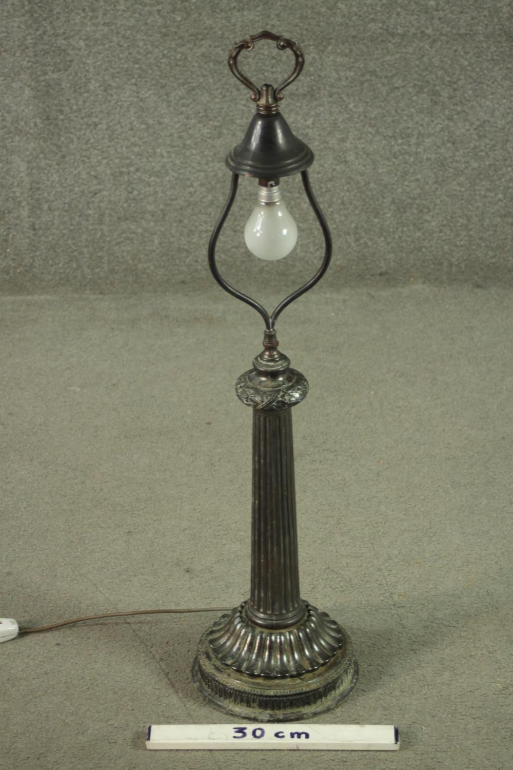 A vintage metal table lamp with ribbon and acorn decoration above a tapering fluted column on - Image 2 of 6