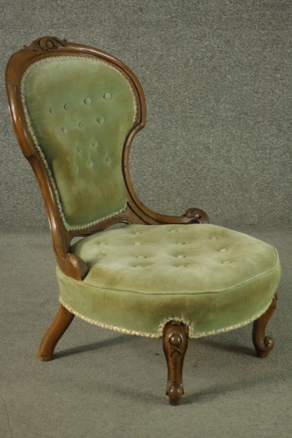 A late 19th century French walnut nursing chair, upholstered with green velour to the buttoned - Image 2 of 6