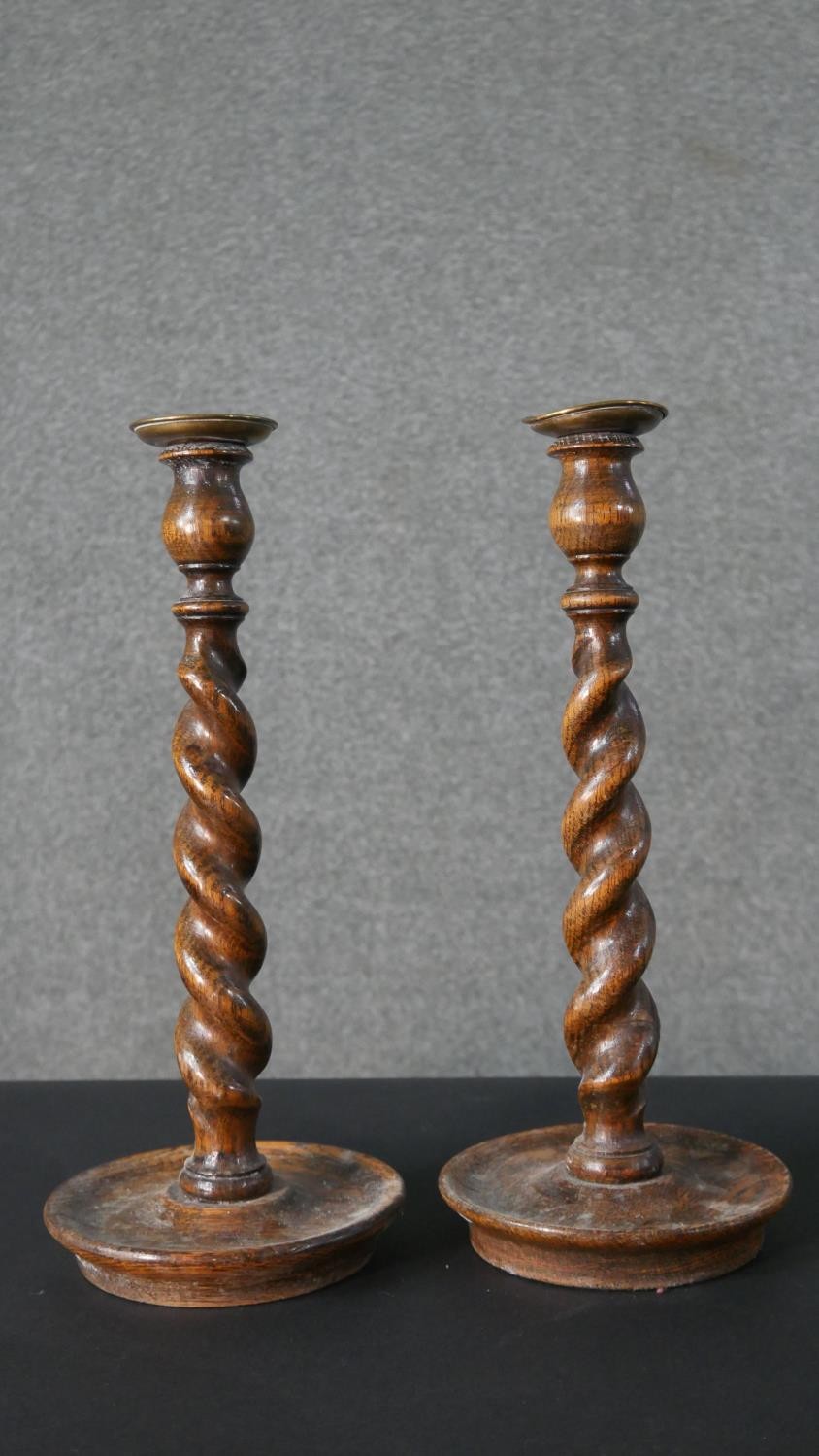 A pair of vintage oak barleytwist candlesticks along with a collection of five carved rustic - Image 3 of 8