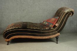 A late Victorian chaise longue, upholstered in velour, with sections of a Persian Sarouk rug applied