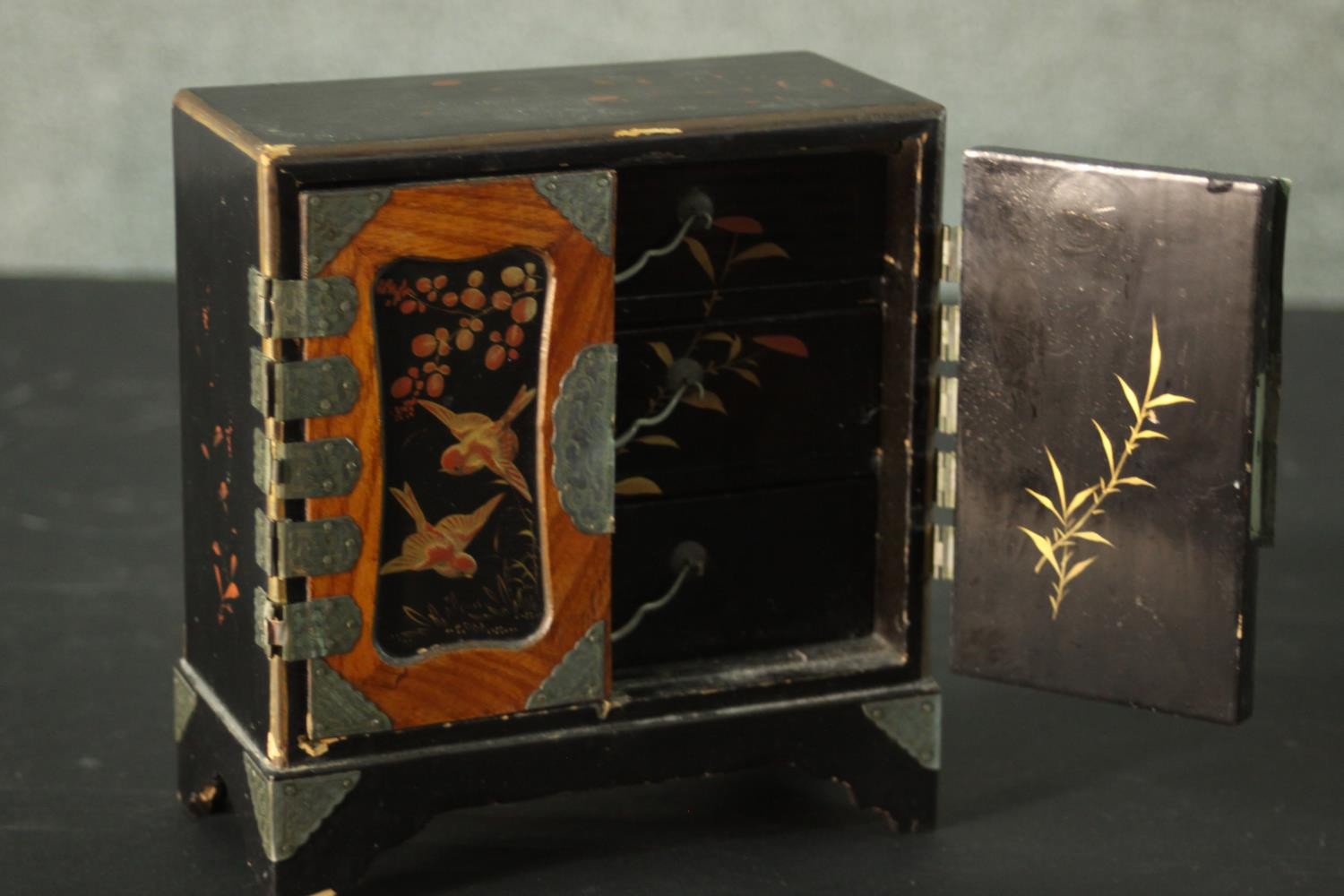 A small Japanese lacquer jewellery cabinet decorated with flowers and birds. (left door does not - Image 2 of 4