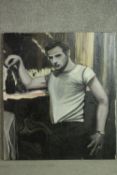 An unframed oil on canvas on board of a man at a bar, signed S. Dyas. H.98 W.84cm.