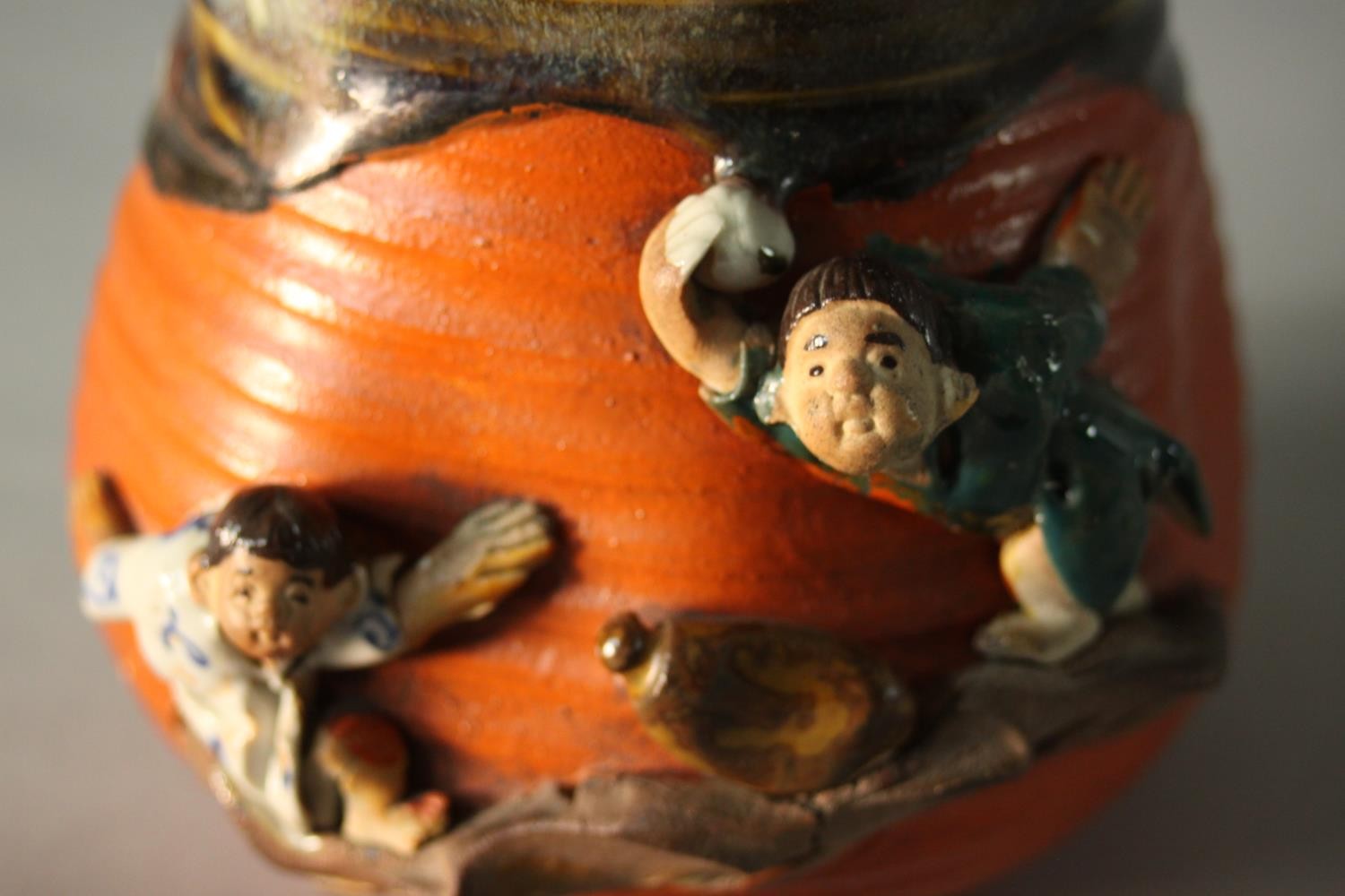 A glazed and hand painted ceramic figural design Japanese lidded jar. Decorated with young - Image 4 of 7