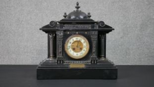 A Victorian black slate classica architectural design mantle clock, white enamel and gilt dial, with