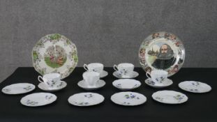 A five person part fine china tea set with violet design along with a Royal Doulton plate and