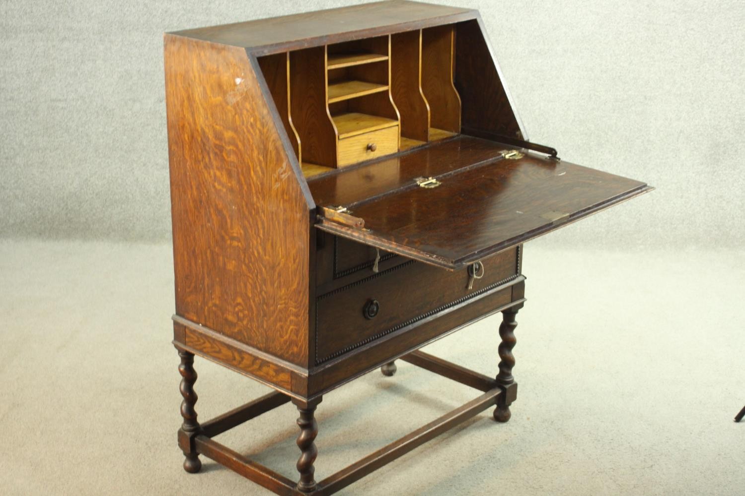 An early 20th century oak bureau, the fall front opening to reveal a fitted interior consisting of - Image 7 of 8