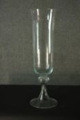 An early 20th century elongated blown clear glass storm lantern. H.80 Dia. 25cm.